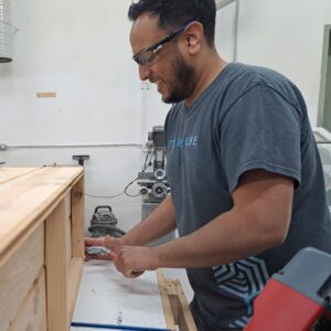 Portrait of Adam at Maker Cube in Langley, BC, instructor and multi discipline maker with upholstery, machining, and custom car audio experience