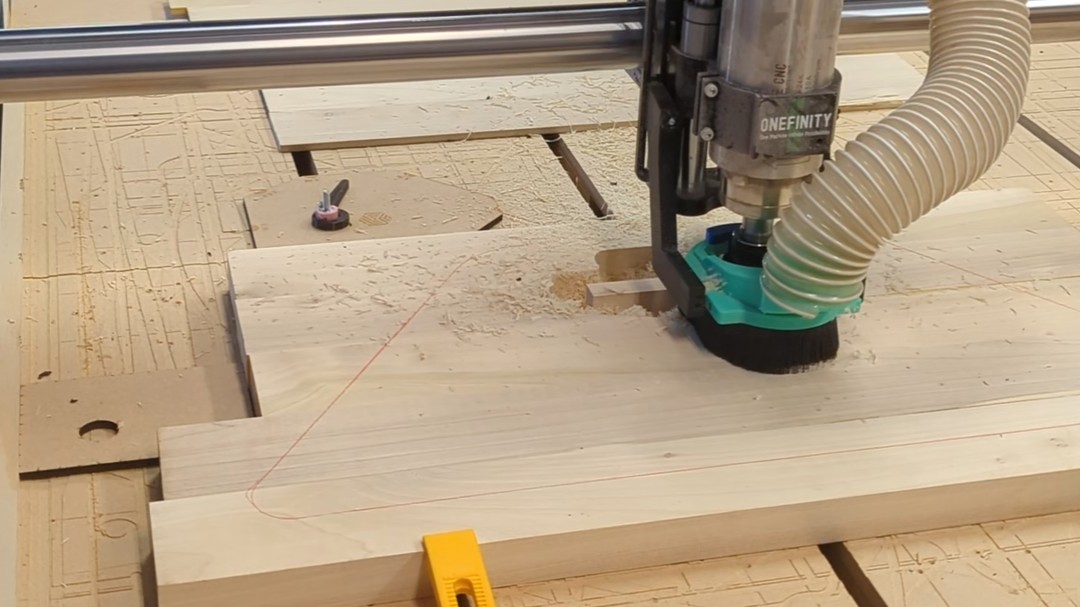 Onefinity Foreman Elite CNC at Maker Cube cutting a hardwood workpiece with a VFD spindle and custom 3D-printed dust shoe (Langley, BC)