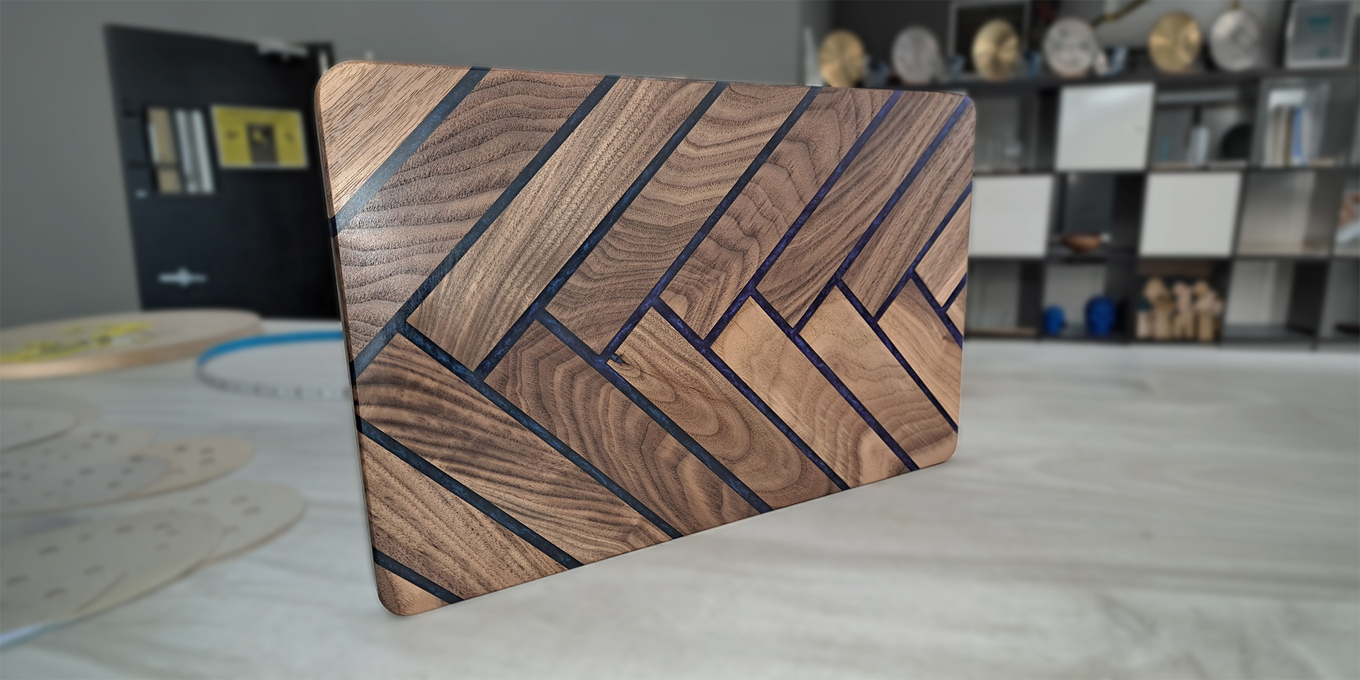 Epoxy charcuterie board banner for Maker Cube in Langley, BC, hardwood herringbone pattern with colored epoxy inlay